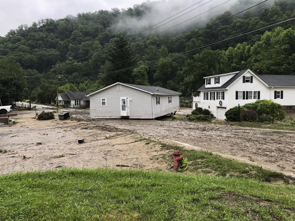 Damage from flooding is shown in the Whitewood community of Buchanan County, Va., Wednesday, July 13, 2022. Flooding in a remote pocket of southwest Virginia has damaged more than 100 homes and left some 40 people unaccounted for, but there are no confirmed deaths or injuries, authorities said Wednesday. (Olivia Bailey/WCYB via AP)