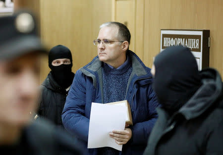 FILE PHOTO: Former U.S. marine Paul Whelan who is being held on suspicion of spying, is escorted out of a courtroom after a ruling regarding extension of his detention, in Moscow, Russia, February 22, 2019. REUTERS/Shamil Zhumatov/File Photo