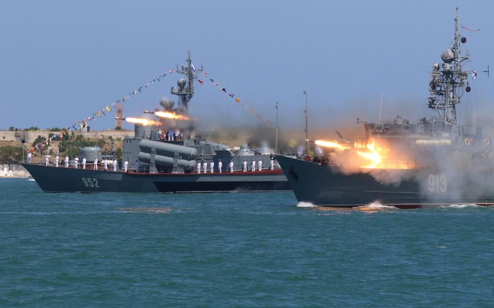 A Russian Navy's minesweeper Kovrovets fires missiles - Credit: REUTERS/Pavel Rebrov