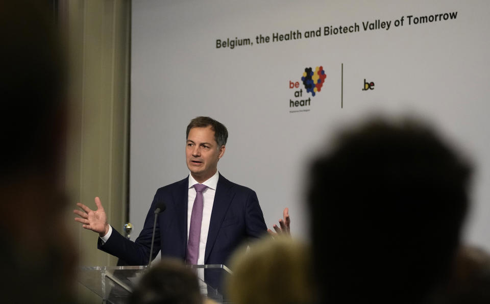 Belgium's Prime Minister Alexander De Croo addresses a conference on biotech at the Residence Palace in Brussels, Tuesday, Oct. 26, 2021. More than 100 Belgian and international executives from the health and biotech sector met in Brussels Tuesday to discuss a forward looking process in the development and production of COVID-19 vaccines. (AP Photo/Virginia Mayo)