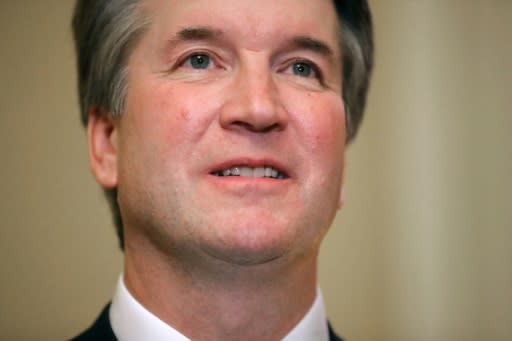 Judge Brett Kavanaugh poses for photographs before meeting with Senate Majority Leader Mitch McConnell