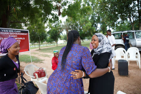 Members of the "Bring Back Our Girls" campaign group are seen as they rejoice over the news of the release of additional 21 girls in Abuja, Nigeria October 13, 2016. REUTERS/Afolabi Sotunde