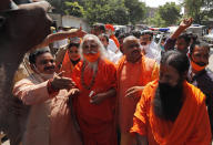 Former lawmaker from India's ruling Bharatiya Janata Party (BJP) Ram Vilas Vedanti, second left, an accused in the 1992 attack and demolition of a 16th century mosque, celebrates with others outside a court in Lucknow, India, Wednesday, Sept. 30, 2020. An Indian court on Wednesday acquitted all 32 accused, including senior leaders of the ruling Hindu nationalist Bharatiya Janata Party, in the case. The demolition sparked Hindu-Muslim violence that left some 2,000 people dead. (AP Photo/Rajesh Kumar Singh)