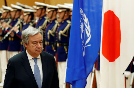 U.N. Secretary-General Antonio Guterres reviews an honor guard with Japan's Prime Minister Shinzo Abe before their meeting at Abe's official residence in Tokyo, Japan, December 14, 2017. REUTERS/Toru Hanai