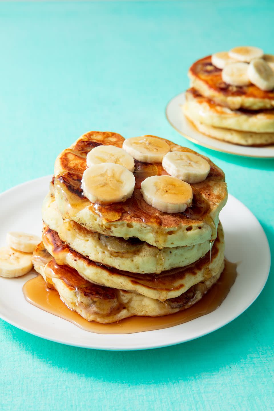 <p>Make mom the fluffy pancakes she deserves. The sour cream in these pancakes are key, but feel free to use full fat plain yogurt if you're out. </p><p>Get the <strong><a href="https://www.delish.com/cooking/recipe-ideas/a19880159/banana-pancake-recipe/" rel="nofollow noopener" target="_blank" data-ylk="slk:Banana Pancakes recipe;elm:context_link;itc:0;sec:content-canvas" class="link ">Banana Pancakes recipe</a>.</strong></p>
