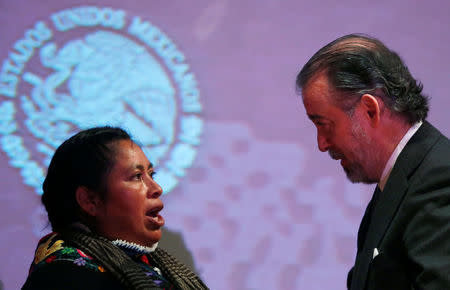 Jacinta Francisco (L), one of the three indigenous women who were wrongfully jailed for years, talks with Attorney General Raul Cervantes after a formal apology from the Attorney General's Office, in Mexico City, Mexico February 21, 2017. REUTERS/Carlos Jasso