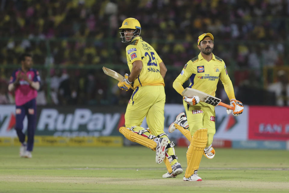 Ravindra Jadeja, right, and Shivam Dube of Chennai Super Kings take a run during the Indian Premier League cricket match between Rajasthan Royals and Chennai Super Kings in Jaipur, India, Thursday, April 27, 2023. (AP Photo/Surjeet Yadav)