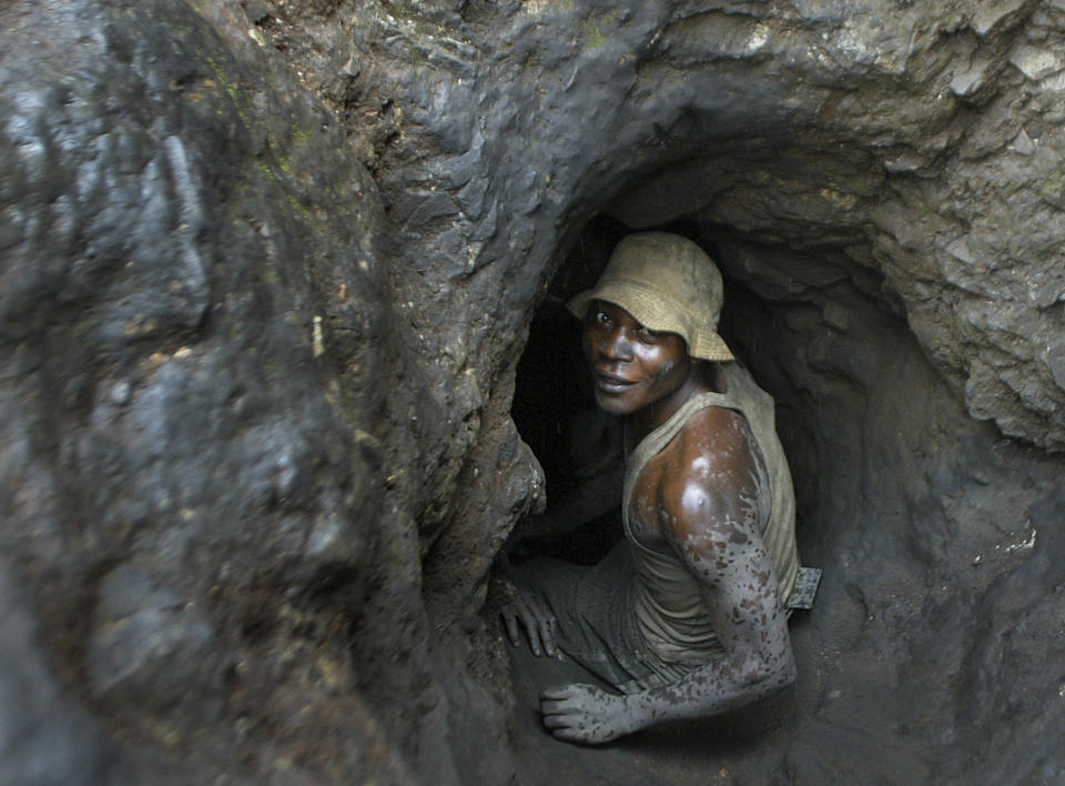 FILE - A man enters one of the tunnels dug with shovels in the Shinkolobwe Cobalt mine, 35km from the town of Likasi, in South Eastern, Democratic Republic of Congo, April 10, 2004. Eastern Congo has been beset by conflict for years, with M23 one of more than 100 armed groups vying for a foothold in the mineral-rich area near the border with Rwanda (AP Photo/Schalk van Zuydam, File)