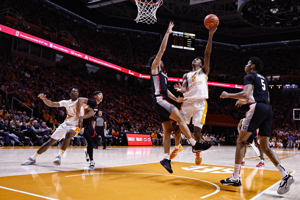 Tennessee forward Julian Phillips (2) shoots over Georgia guard Jabri Abdur-Rahim (1) during the first half of an NCAA college basketball game Wednesday, Jan. 25, 2023, in Knoxville, Tenn. (AP Photo/Wade Payne)