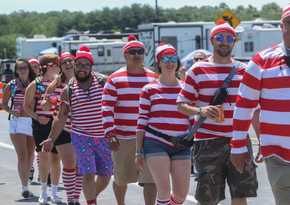 A group dressed as Where's Waldo wait outside of the east entrance at Firefly in Dover in 2019.