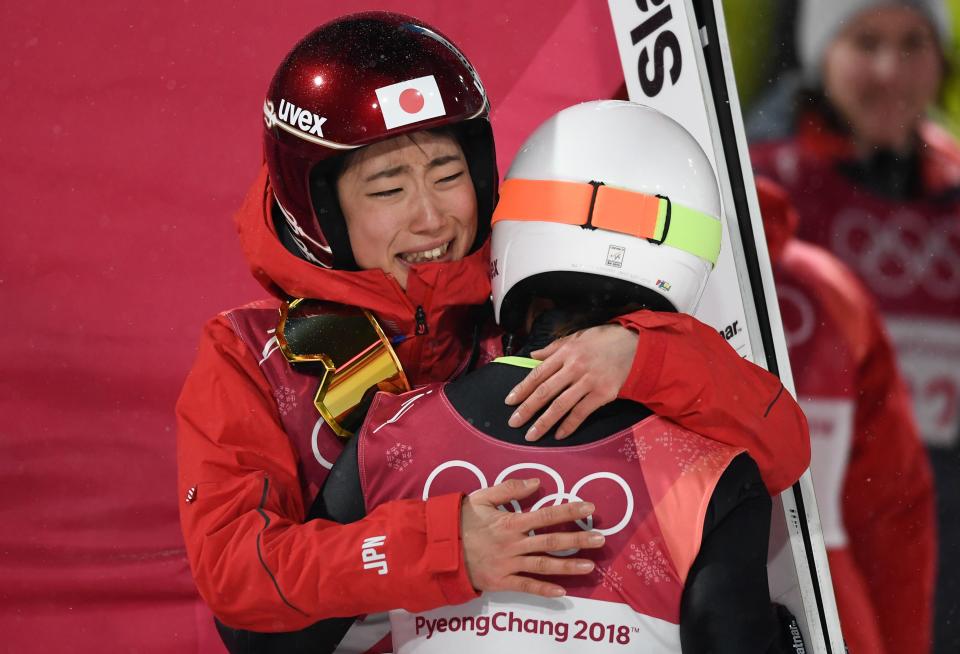 <p>Japan’s Kaori Iwabuchi (L) hugs her compatriot Sara Takanashi after winning the bronze medal in the women’s normal hill individual ski jumping event during the Pyeongchang 2018 Winter Olympic Games on February 12, 2018, in Pyeongchang. </p>