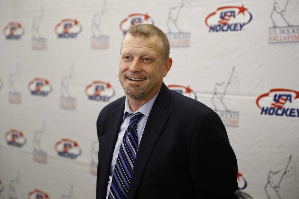 Former Boston Bruins goalie Tim Thomas speaks with members of the media before being inducted into the U.S. Hockey Hall of Fame, Thursday, Dec. 12, 2019, in Washington. (AP Photo/Patrick Semansky)