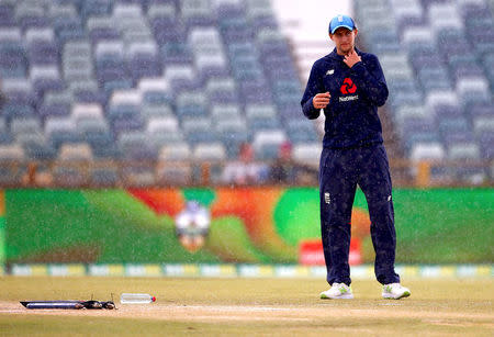 Cricket - Ashes test match - Australia v England - WACA Ground, Perth, Australia, December 18, 2017. England's captain Joe Root stands near the pitch as rain delays the start of the fifth day of the third Ashes cricket test match. REUTERS/David Gray