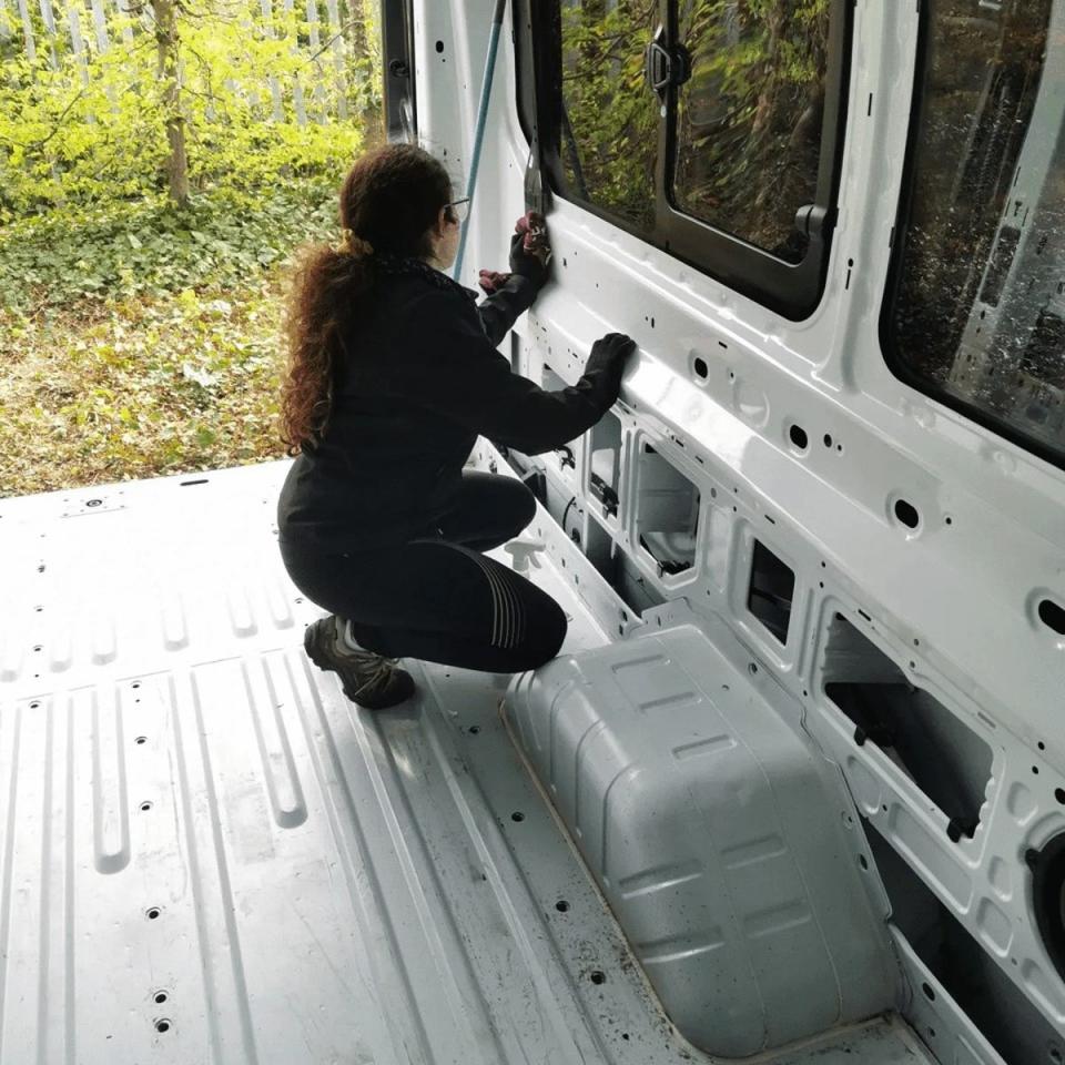 Mariona working on the van (Robert Bolohan)