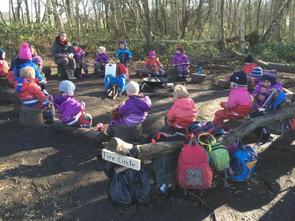 Youngsters start the day with “circle time” as they discuss the three rules of the forest (Alex Lentati)