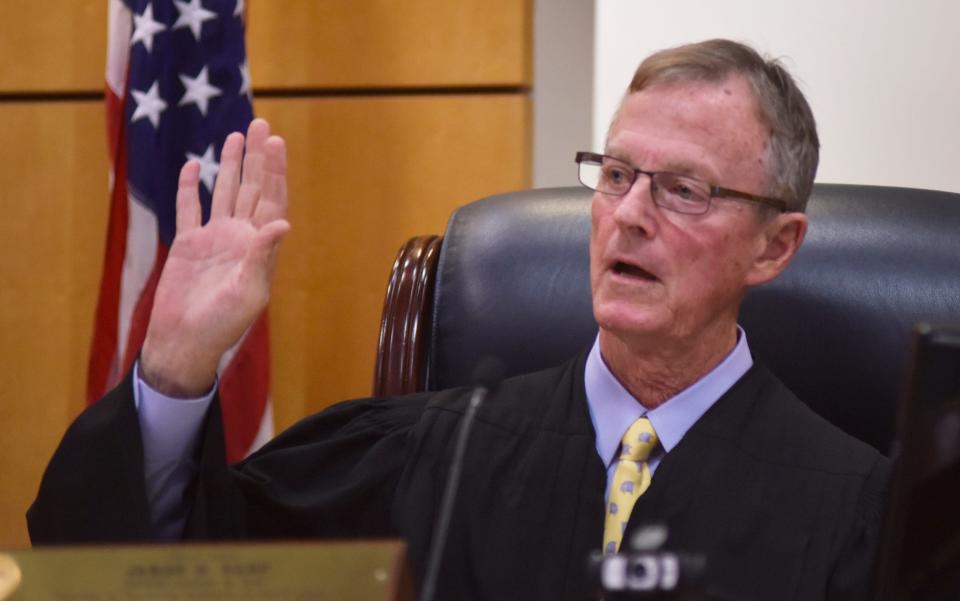 Judge James Earp.  Brevard School Board Member Jennifer Jenkins and her attorneys,  and attorneys for State Rep.Randy Fine in a Viera courtroom on January 12.