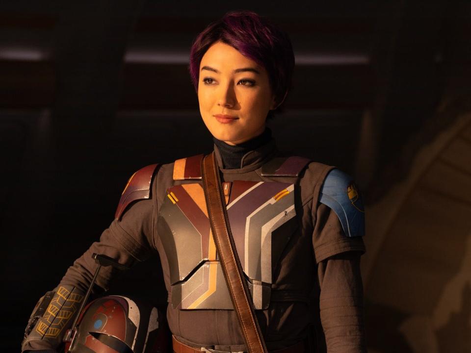 Natasha Liu Bordizzo as Sabine Wren holding her Mandalorian helmet in "Ahsoka."