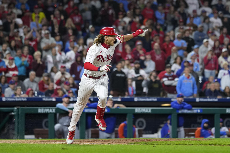 Philadelphia Phillies' Alec Bohm reacts after hitting the game-winning run-scoring single against New York Mets pitcher Adam Ottavino during the 10th inning of a baseball game, Friday, Sept. 22, 2023, in Philadelphia. (AP Photo/Matt Slocum)