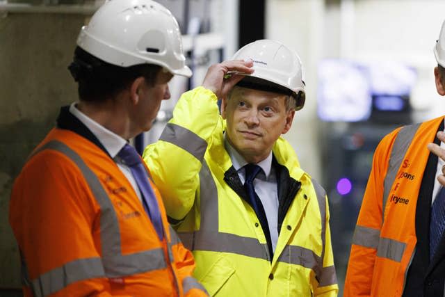 Grant Shapps wearing hard hat and hi vis jacket