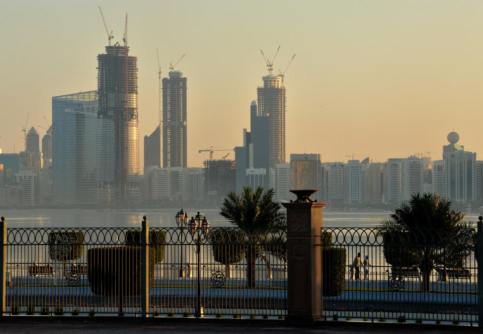 An early morning sun lights the Abu Dhabi skyline. (Photo: Getty Images)