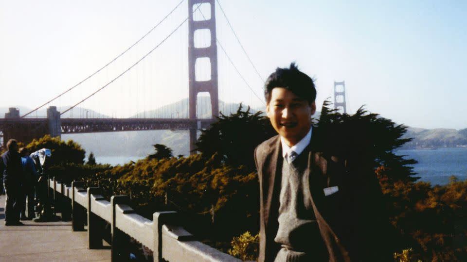Xi Jinping, then 31 years old, poses for photos in front of the Golden Gate Bridge as he visits San Francisco in 1985. - Xinhua/Newscom