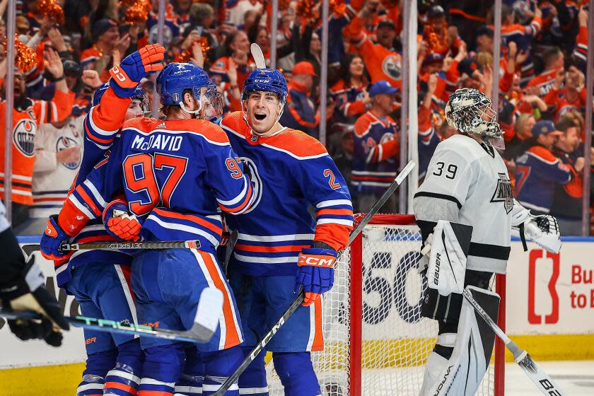 EDMONTON, AB - APRIL 22: Edmonton Oilers Defenceman Evan Bouchard (2) celebrates a goal.