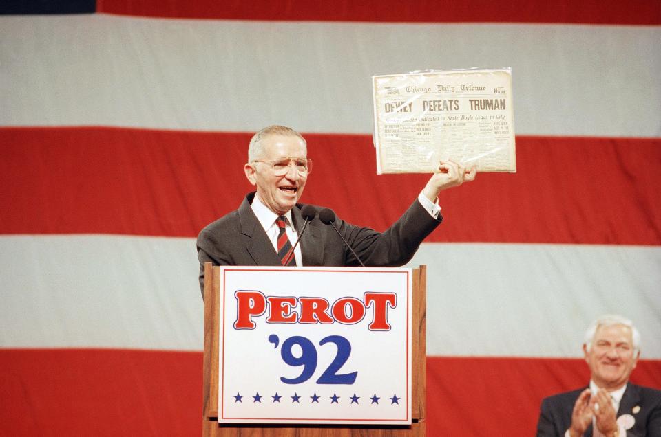 Independent presidential candidate Ross Perot holds aloft a copy of the 1948 Chicago Daily Tribune newspaper proclaiming Thomas Dewey the winner over Harry Truman in that year's presidential election.   Perot displayed the paper while addressing a rally Sunday, Nov. 1, 1992 in Long Beach, Calif.