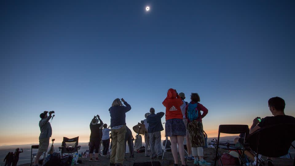 Locals and travelers from around the world gather on Menan Butte to watch the solar eclipse on August 21, 2017 in Menan, Idaho. - Natalie Behring/Getty Images