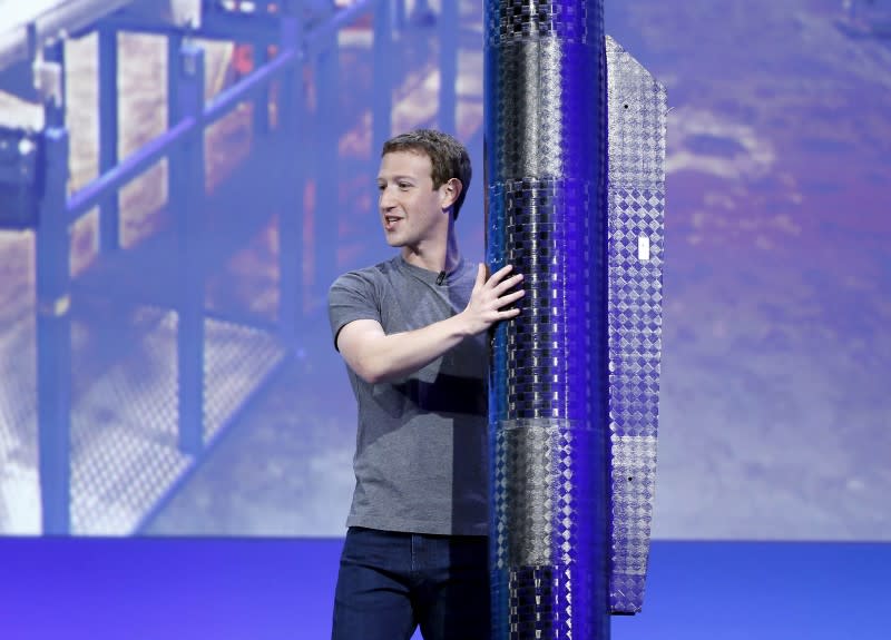 Facebook CEO Mark Zuckerberg holds a propeller pod of the solar-powered Aquila drone on stage during a keynote at the Facebook F8 conference in San Francisco, California April 12, 2016. REUTERS/Stephen Lam/File Photo