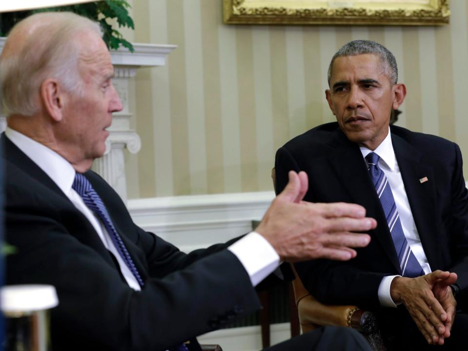 US President Barack Obama (R) listens to Vice President Joe Biden as they release the Cancer Moonshot Report in the Oval Office of the White House in Washington, DC on October 17, 2016.