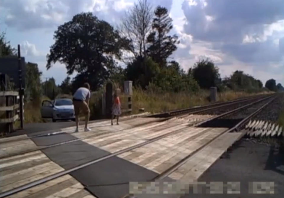 Shocking CCTV shows people risking their lives on level crossings - to take PICTURES