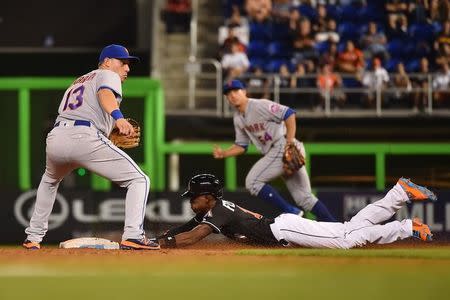 Sep 26, 2016; Miami, FL, USA; Miami Marlins second baseman Dee Gordon slides in safely to steal second base in the game against the New York Mets at Marlins Park. Mandatory Credit: Jasen Vinlove-USA TODAY Sports