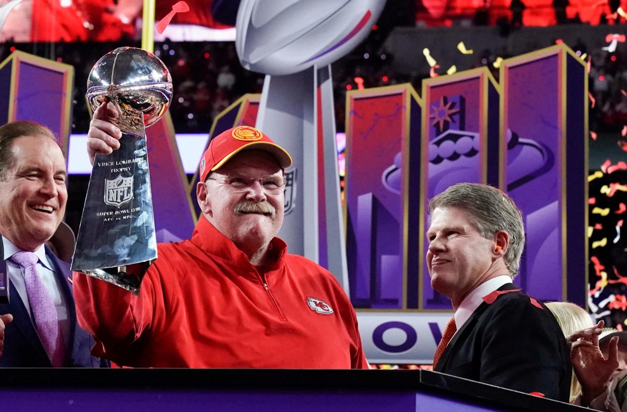 Kansas City Chiefs head coach Andy Reid holds the trophy next to Kansas City Chiefs' owner, chairman and CEO Clark Hunt as they celebrate winning Super Bowl LVIII against the San Francisco 49ers at Allegiant Stadium in Las Vegas, Nevada, February 11, 2024.