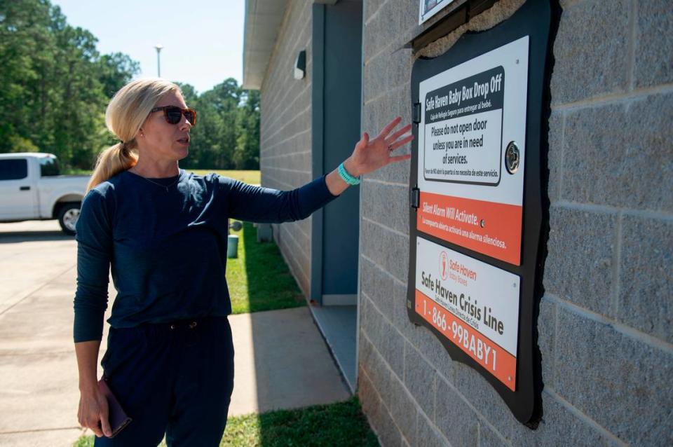 Caitlin Kelly shows off the Safe Haven Baby Box at the Long Beach Fire Department in Long Beach on Thursday, June 20, 2024. Long Beach’s baby box was the first in Mississippi.