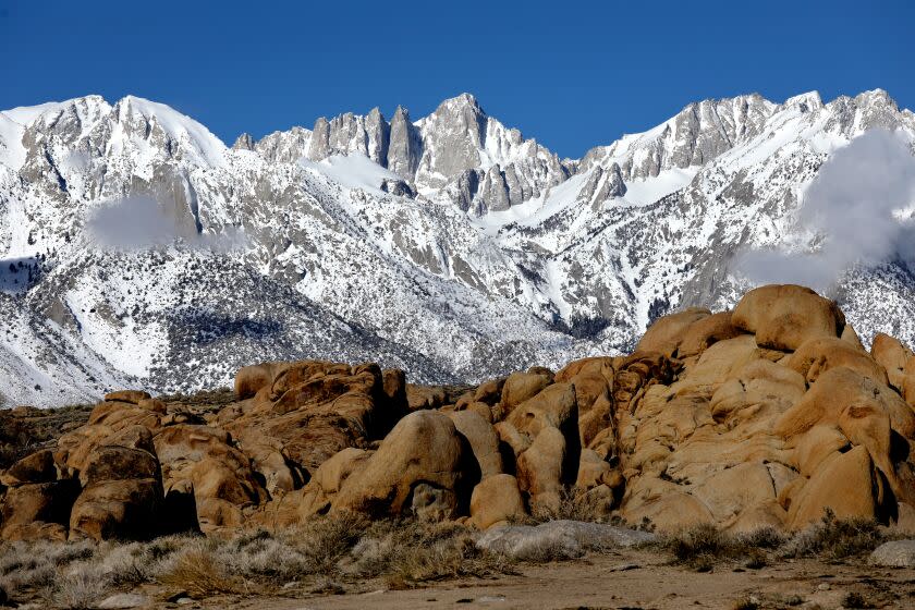 LONE PINE, CA - MARCH 23: Mount Whitney, the highest mountain in the contiguous United States and the Sierra Nevada, with an elevation of 14,505 feet, is located on the east side of the Sierra Nevada mountain range, with the Alabama Hills, foreground, shown from Whitney Portal Road on Thursday, March 23, 2023 in Lone Pine, CA. Flash flooding along the eastern Sierra Nevada a week ago caused an unprecedented breach in the City of Los Angeles Department of Water and Power Los Angeles Aqueduct, as well as other damage. (Gary Coronado / Los Angeles Times)
