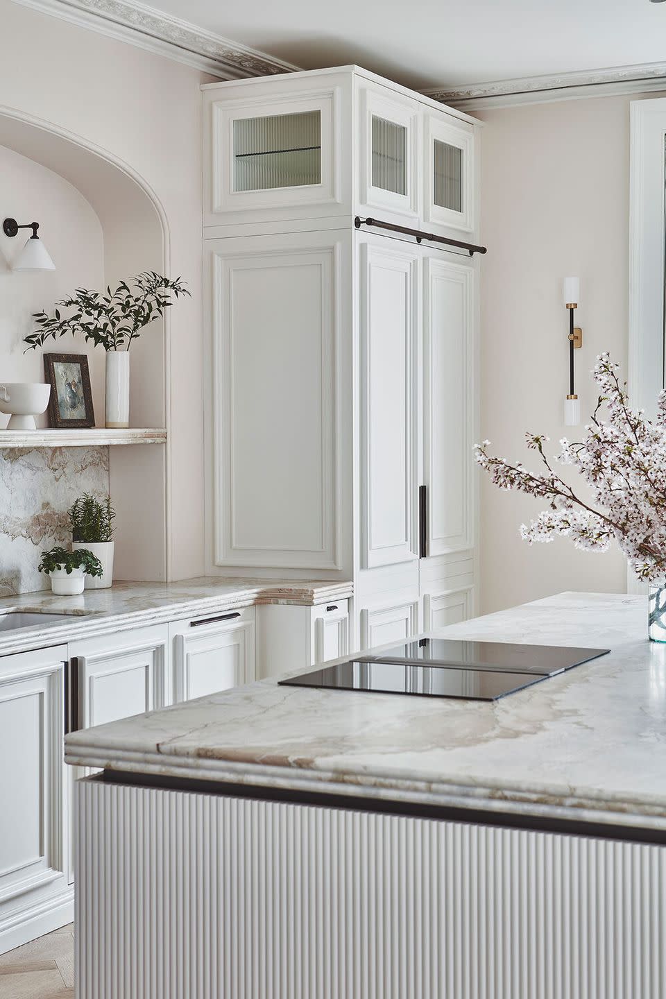 <p>This kitchen uses plenty of surface detailing – ridged fronts to the kitchen island, decorative moulding, and reeded glass – to add interest and depth to pure white cabinetry. A clever device to prevent your white cabinets from appearing too slick or clinical.</p><p>Pictured: <a href="https://www.blakeslondon.com/bathtownhouse" rel="nofollow noopener" target="_blank" data-ylk="slk:Kitchen by Blakes London;elm:context_link;itc:0;sec:content-canvas" class="link ">Kitchen by Blakes London</a></p>