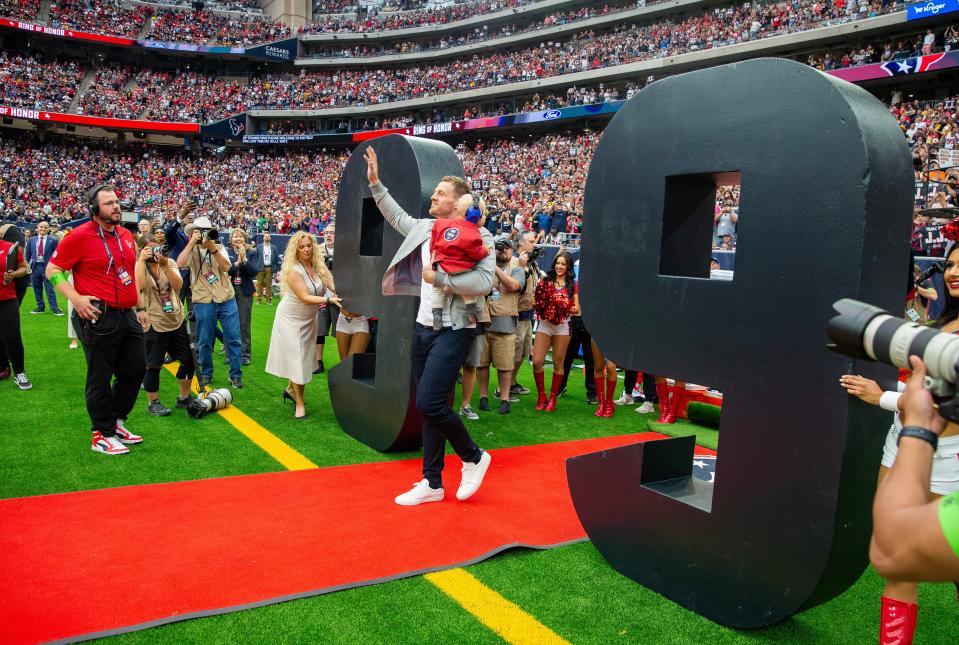 Former Texans star J.J. Watt waves to the fans during his Ring Of Honor Ceremony at halftime of the Texans-Steelers game at NRG Stadium in Houston on Oct. 1, 2023.