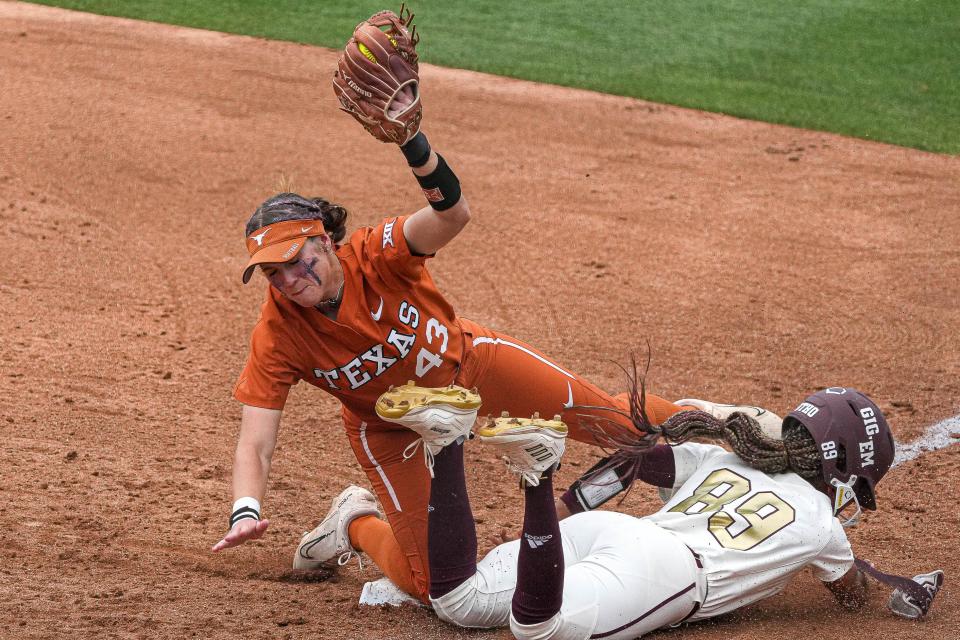 Texas' Leighann Goode forces out Texas A&M's Star Ferguson at first base during Sunday's regional final. Texas coach Mike White has led all 13 of his eligible teams at UT and Oregon to at least the NCAA super regional round.