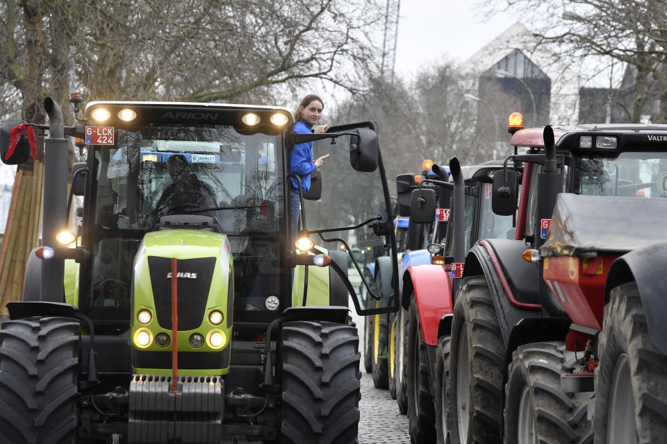 Farmers with their tractors block traffic on a road in the center of Brussels, during a demonstration, Friday, March 3, 2023. Hundreds of tractors driven by angry farmers protesting a plan to cut nitrate levels drove into Belgium's capital city on Friday causing major traffic disruption. (AP Photo/Geert Vanden Wijngaert)