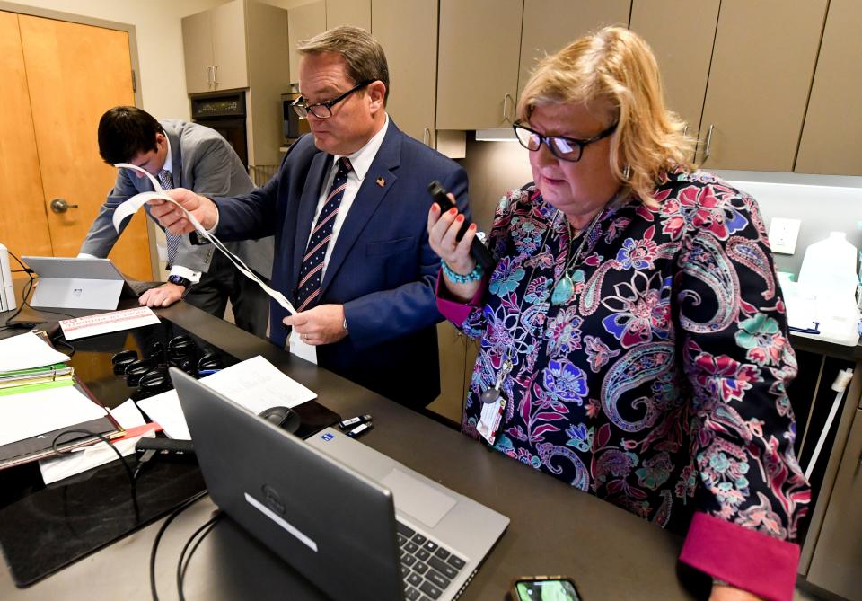 Tuscaloosa County Probate Judge Rob Robertson verifies the voting machine totals for each polling station at the Tuscaloosa County Courthouse Annex Auditorium Tuesday, Nov. 8, 2022. Robertson is assisted by Zach Wolfe and Diane Duncan.