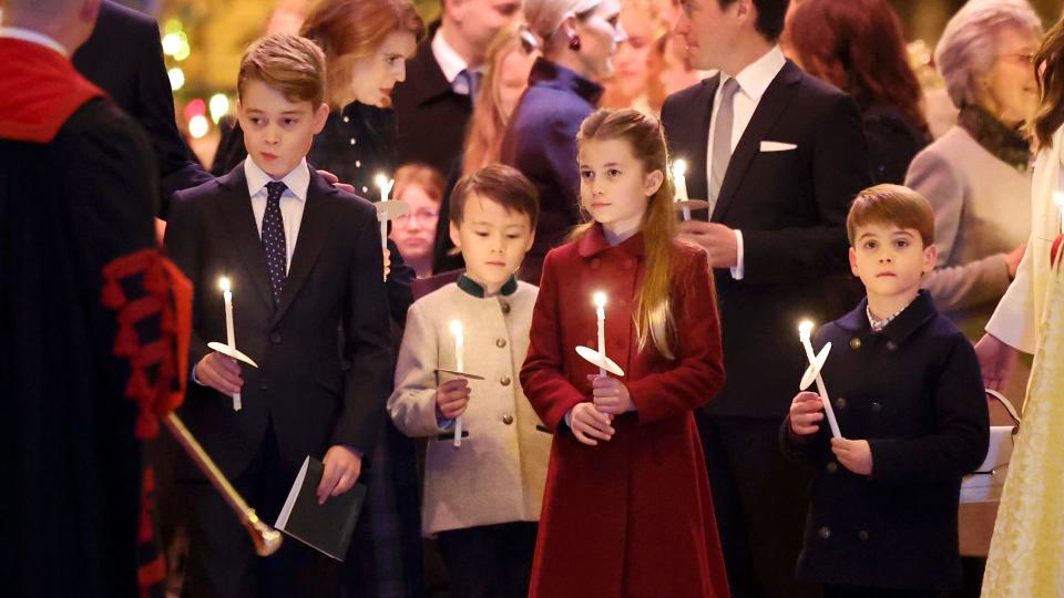 George, Charlotte and Louis holding candles