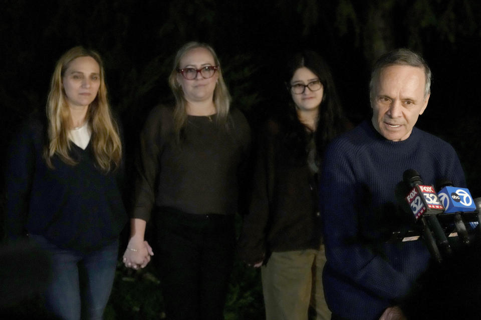 Uri Raanan, right, talks to reporters outside his Bannockburn, Ill., home with his sister Sigal Zamir, left, wife Paola Raanan, center, and her daughter Frida Alonso, after his daughter Natalie and her mother Judith Raanan were released by Hamas, Friday, Oct. 20, 2023. (AP Photo/Charles Rex Arbogast)