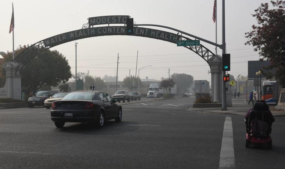 Smoke hangs over downtown Modesto, Calif. at 9th and I streets Friday November 16, 2018. The San Joaquin Valley Air Pollution Control District has extended an Air Quality Alert for Stanislaus County and surrounding areas because of the California Wildfires.