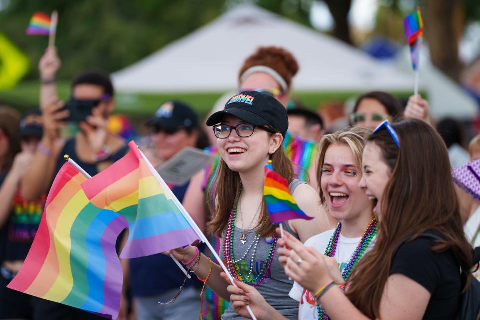 People watch as the Phoenix Pride Parade travels down Third Street toward Steele Indian School Park on Oct. 16, 2022.