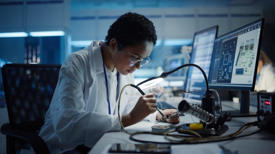 A person designing components for a circuit board.