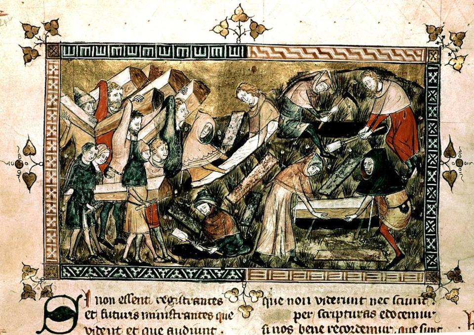 An illustration in the Annales of Gilles de Muisit, from the 14th century, depicts people burying victims of the Black Death. <a href="https://www.gettyimages.com/detail/news-photo/the-annales-of-gilles-de-muisit-the-plague-in-tournai-news-photo/535795241?adppopup=true" rel="nofollow noopener" target="_blank" data-ylk="slk:Photo by Photo12/Universal Images Group via Getty Images;elm:context_link;itc:0;sec:content-canvas" class="link ">Photo by Photo12/Universal Images Group via Getty Images</a>