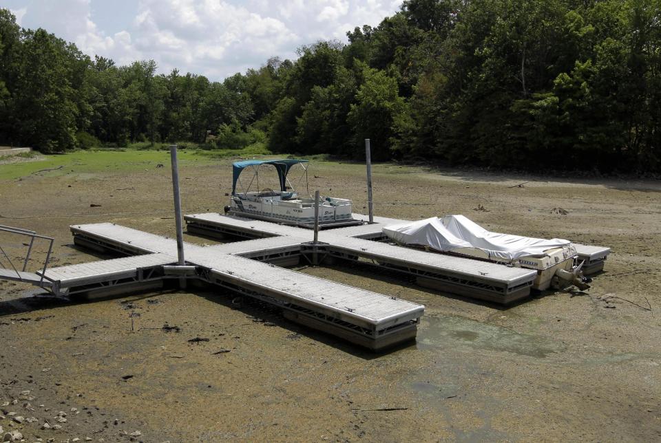 Boats sit on the bottom in a dry cove at Morse Reservoir in Noblesville, Ind., Monday, July 16, 2012. The reservoir is down nearly 6 feet from normal levels and being lowered 1 foot every five days to provide water for Indianapolis. (AP Photo/Michael Conroy)