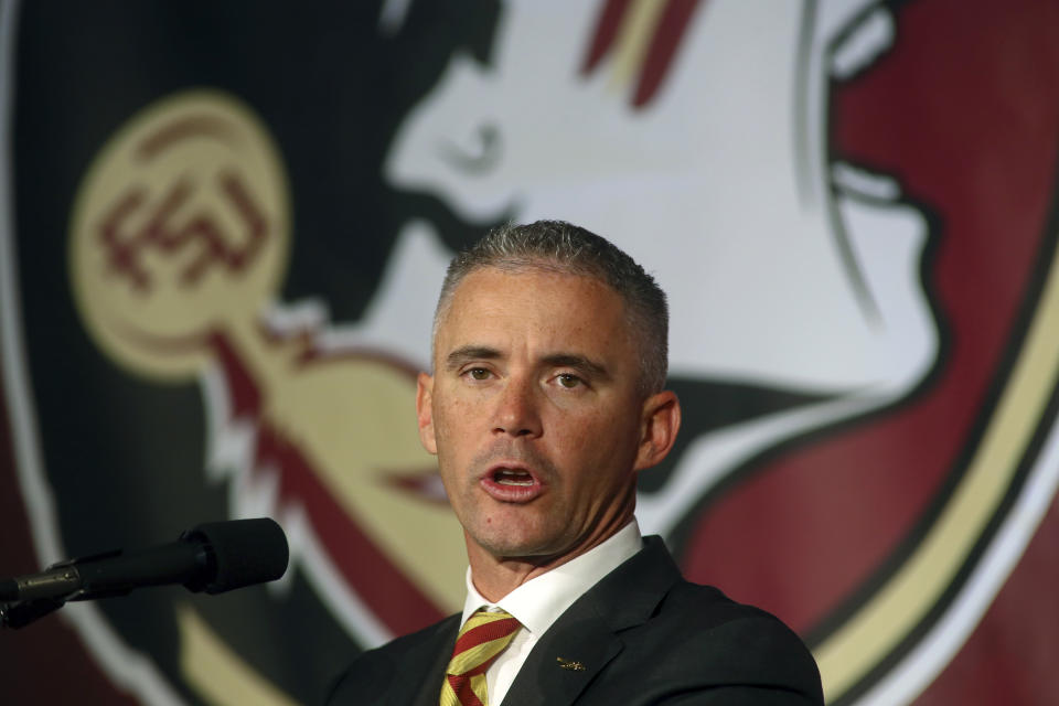 FILE - In this Dec. 8, 2019, file photo, Florida State head football coach Mike Norvell speaks during an NCAA college football news conference in Tallahassee, Fla. The NCAA has lifted the recruiting dead period that has been in place since March 13, 2020, due to the pandemic. The NCAA returned to its usual recruiting calendar Tuesday, June 1, 2021, allowing prospects to meet coaches in person and for coaches to conduct live evaluations of recruits. Florida State was welcoming recruits to campus just after midnight as part of its “Midnight Madness” event to mark the end of the dead period.(AP Photo/Phil Sears, File)