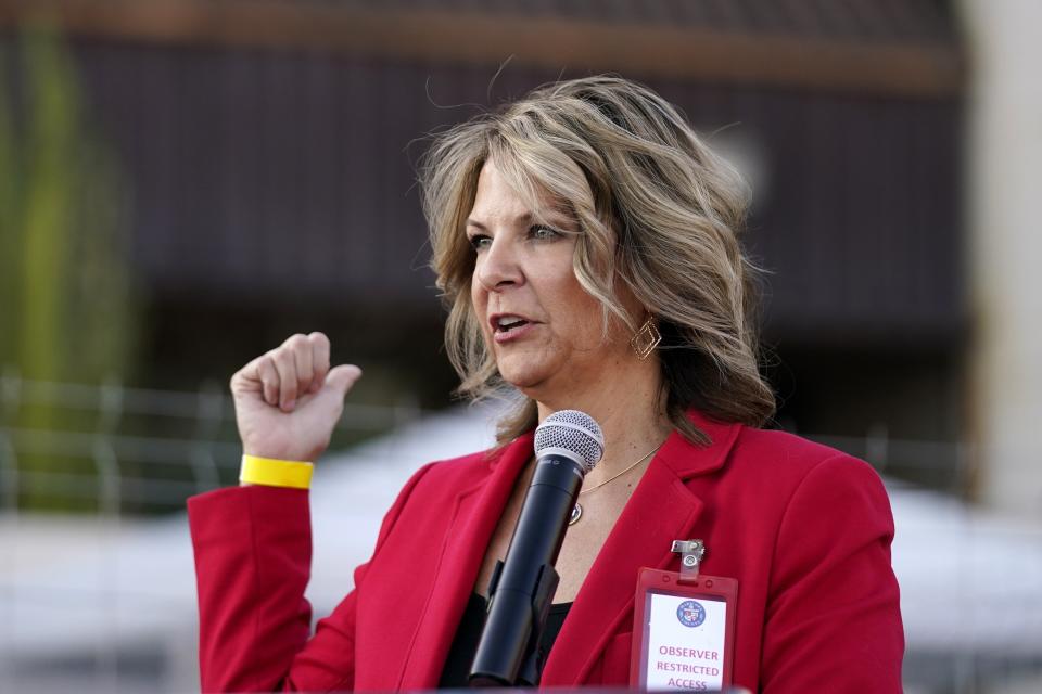 FILE - In this Nov. 18, 2020, file photo, Dr. Kelli Ward, chair of the Arizona Republican Party, holds a press conference in Phoenix. The Arizona Republican Party is confronting its future this weekend after losing a second Senate seat and the presidential race. On the agenda for the state committee meeting Saturday: the reelection bid by its controversial chairwoman, who has been among the most prolific promoters of baseless election conspiracies, and the censure of some of the party's best-known figures: Cindy McCain, former Sen. Jeff Flake and Gov. Doug Ducey. (AP Photo/Ross D. Franklin, File)