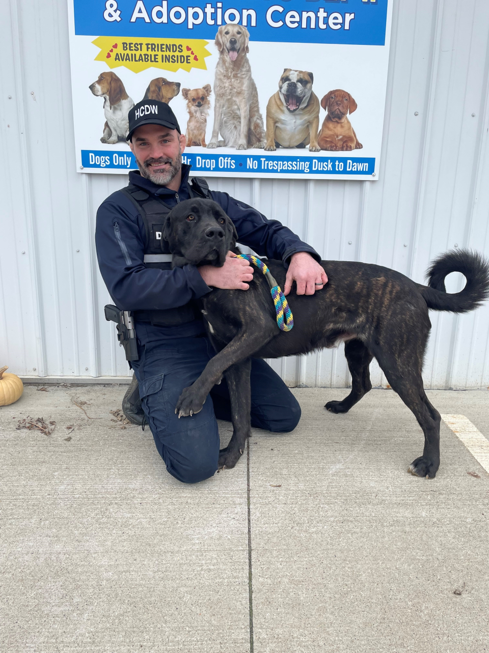 Dog Warden, Jonathan Beam is pictured with Tic who is available for adoption at the Holmes County Dog Warden’s Department and Adoption Center.